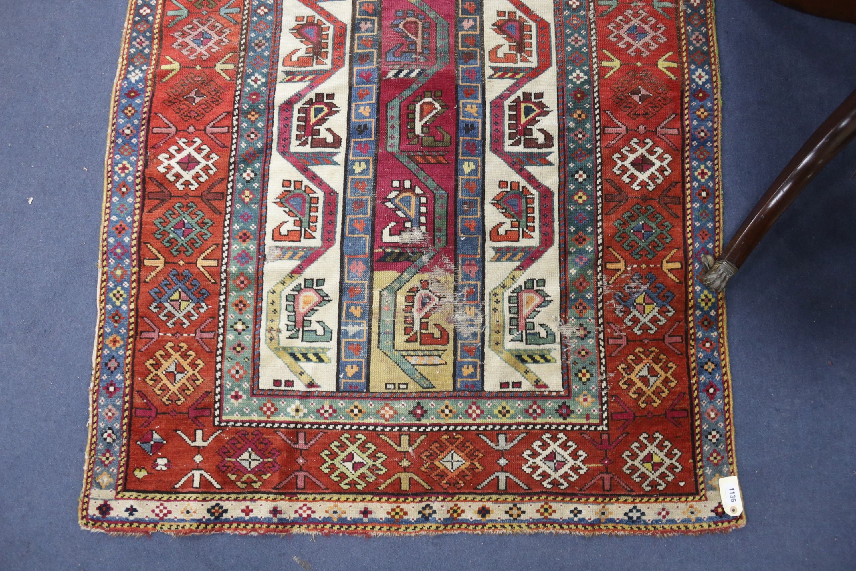 A Caucasian geometric rug, 284 x 118cm